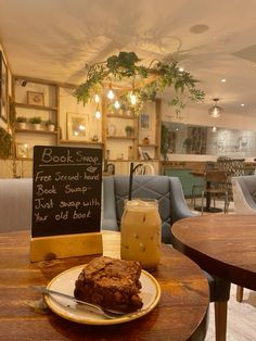 a table with a plate of food on it and a sign that says book street