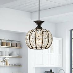 a light fixture hanging from the ceiling in a kitchen