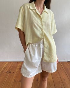 Vintage 90s minimal yellow resort shirt. Features an open revere collar, short sleeves and a subtle textured self stripe. In a soft yellow lightweight fabric.  Brand: CityLife Size label reads EU 42. 100% Polyester.  Based on measurements recommended size UK  8-12 // EU 36-40 // US 4-8  Model is UK size 6/8 and 5'4 and it has an oversized fit.  Length at front: 66cm Bust width (flat): 54cm Sleeve length: 25cm Great condition. Expected signs of wear considering age but nothing notable.  Sourced i Yellow Relaxed Fit Short Sleeve Blouse, Classic Yellow Summer Blouse, Yellow Blouse With Relaxed Fit And Short Sleeves, Yellow V-neck Summer Shirt, Relaxed Fit Yellow Summer Blouse, Yellow Short Sleeve Shirt For Daywear, Classic Yellow Summer Shirt, Blue Suede Jacket, Yellow Striped Shirt