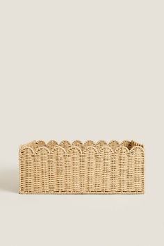 an empty wicker basket on a white background