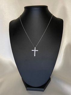 Celebrate your faith with this stunning silver cross necklace. Made of sterling silver and cubic zirconia, this piece will be a beautiful addition to your collection. solid 925 Sterling Silver Length: 15.5 in + 2.5 in extender pendant: about 0.875 in x 0.625 in  Safe to be worn in water Package in a bag/pouch * pink available on a separate listing White Cross Pendant Necklace With Clavicle Chain, White Cross Necklace With Clavicle Chain, Clear Cubic Zirconia Cross Pendant Necklace, Diamond White Cubic Zirconia Cross Necklace, Sterling Silver Cross Necklace With Clavicle Chain, Diamond White Cubic Zirconia Cross Pendant Necklace, Diamond White Cross Necklace, White Gold Cubic Zirconia Cross Necklace, White Gold Sterling Silver Cross Necklace