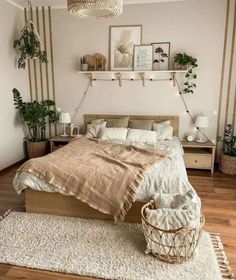 a bedroom with a bed, nightstands and potted plants on the wall above it