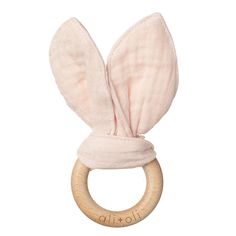 a wooden ring with a pink bunny ear on it