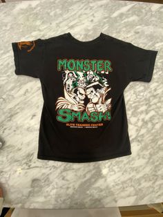 a black shirt that says monster shark on it