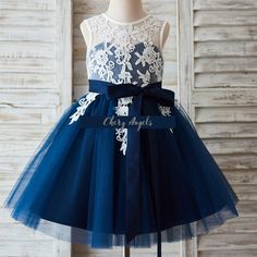 This dress is made of ivory lace with navy blue princess tulle skirt; V back with a detachable satin belt; Perfect yet classic ivory/navy color combo This  white and Blue dress is suits for flower girls, as communion dress or any occasion. Simple but elegant dress. Please message us to get detail size guide and videos of the dress. Dark Blue Bridesmaid Dresses, Party Dress Blue, Navy Blue Bridesmaid Dresses, Satin Belt, White And Blue Flowers, Blue Bridesmaid Dress, August Wedding, Blue Party Dress, Wedding Flower Girl Dresses