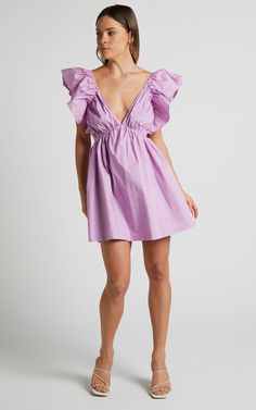 Raiza Mini Dress - Ruffle Sleeve Tie Back Plunge Dress in Lilac Purple V-neck Dress With Ruffle Hem, Lavender Ruffled Dress For Date Night, Chic Lavender Dress With Ruffle Hem, Mauve Mini Dress For Spring Date Night, Lavender V-neck Dress For Date Night, Chic Mauve V-neck Mini Dress, Chic Mauve Mini Dress For Date Night, Chic Mauve Mini Dress For Summer, Purple Ruffled Mini Dress For Date Night