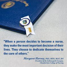 a blue book with a ribbon around it and a quote from the msm college of nursing