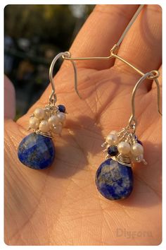 Crafted with celestial elegance, our lapis lazuli and pearl eardrops exude a sense of serenity and grace. #lapisearring#dropearring#wirewrap#silverearring#beachstyle#boohojewelry Artisan Jewelry With Pearl Drop For Gift, Sterling Silver Long Drop Teardrop Earrings For Party, Elegant Silver Teardrop Wrap Earrings, Artisan Sterling Silver Teardrop Dangle Earrings, Bohemian Silver Pearl Earrings For Gifts, Silver Bohemian Pearl Earrings For Gifts, Elegant Teardrop Sterling Silver Hoop Earrings, Bohemian Teardrop Silver Plated Wire Jewelry, Bohemian Sterling Silver Jewelry With Pearl Drop