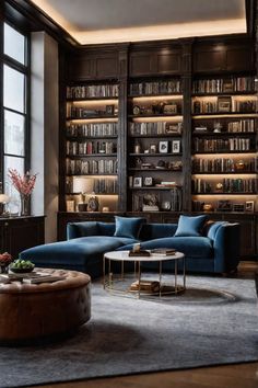 a living room filled with lots of bookshelves next to a couch and coffee table