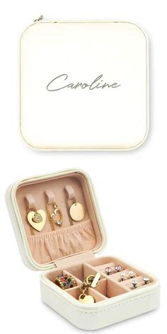 an open white box containing several pairs of earrings and rings with the word carolina written on it