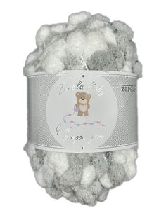 a white ball of yarn with a teddy bear on it