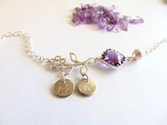 Birthstone Bracelet, Initial charm, Flower bracelet, Amethyst Jewelry, February Jewelry, Personalized Custom Birthday gift, Flower girl Gift.Choose your BIRTHSTONE & INITIALS to make this piece individually yours.As with all of our pieces this Birthstone necklace is made with great care, each letter or symbol is hand stamped and polished by hand.Size:**  Disc diameter is 10 mm** Size of flower is about 14 mm X 20 mmTotal length is approx 6 inches with a 1 inch extension makes this Bracelet total Flower Shaped Charm Bracelet For Gift, Floral Charm Bracelet Gift, Personalized Purple Bracelet Jewelry, Purple Jewelry With Flower Charm For Mother's Day, Lavender Gemstone Bracelet As A Gift, Lavender Gemstone Bracelet For Gift, Lavender Gemstone Bracelet Gift, Gift Amethyst Charms Jewelry, Flower-shaped Bracelets With Charms For Gift