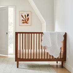 a baby's crib in the corner of a room