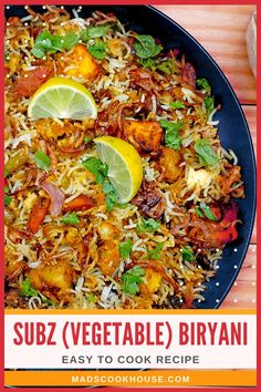 vegetable biriyani recipe in a black plate with lemon wedges