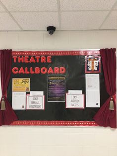 a bulletin board that has been decorated with red and black writing on it, along with other decorations