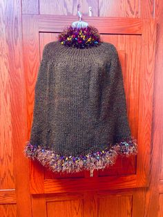 Gorgeous handmade brown wool cape with confetti detailing on turtleneck collar and bottom hem. Hand-knitted Brown Poncho For Fall, Hand Knitted Brown Poncho For Fall, Brown Hand Knitted Winter Poncho, Hand Knitted Brown Poncho For Winter, Wool Cape, Womens Jackets, Confetti, Seattle, Cape