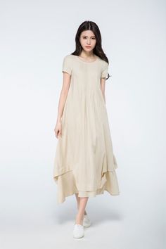 This linen dress is very ease to wear and beautiful. The long linen dress is suitable for any shaped lady. This is a really versatile but unique designer dress.this versatile designer dress can be worn both for daytime or to a party in the evening. Simply pair with the right accessories to dress it up or down depending on the occasion. FEATURESlinen blend50% linen,50% cottonNo liningScoop necklineShort sleeveNo zipperA-lineLoose fit Asymmetrical hemPerfect for summer,spring,autumnMore color, Mor Beige A-line Linen Dress For Spring, Spring Beige A-line Linen Dress, Cream A-line Linen Dress, Elegant Beige Asymmetrical Summer Dress, Casual Beige Midi Dress With Asymmetrical Hem, Cream Linen Midi Dress, Beige Ramie Linen Dress For Summer, Spring Midi Lagenlook Maxi Dress, Beige Asymmetrical Midi Dress For Summer