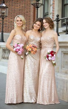 three bridesmaids in gold dresses standing together