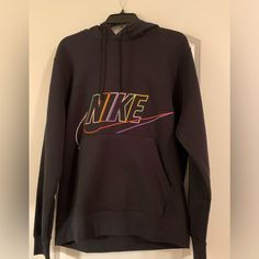 Nike Hoodie Black With Multicolored Logo/Lettering Size Medium Kangaroo Pocket Tag Removed But Never Worn & In New Condition Nike Hoodie With Logo Print For Fall, Nike Long Sleeve Hoodie With Logo Print, Multicolor Logo Print Sweatshirt For Winter, Winter Multicolor Logo Print Sweatshirt, Winter Multicolor Sweatshirt With Logo Print, Nike Sporty Hoodie With Graphic Print, Nike Casual Hoodie With Graphic Print, Nike Black Hoodie With Logo Print, Black Nike Hoodie With Logo Print