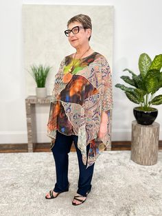 Sterling Style's georgette tops add an artful touch to any look. In a funky mix of prints, this style features an oversized patchwork body with overstitch detailing. A curved hemline points at the sides with vent detail, and it's finished with a round neckline and short dolman sleeves. Fit fact: A generous one-size-fits-most; we recommend for sizes up to 3X Lisa (size 12/14, 5'1") models. Georgette and mixed wovens 100% Artsilk Dry Clean Only Made in India Style # 5432CUTOP Oversized Multicolor Graphic Print Blouse, Bohemian Multicolor Tops With Unique Print, Casual Multicolor Blouse With Unique Print, Casual Tops With Multicolor Mixed Print, Oversized Printed Multicolor Blouse, Oversized Printed Multicolor Tops, Oversized Multicolor Bohemian Tops, Trendy Multicolor Patchwork Blouse, Relaxed Fit Multicolor Patchwork Blouse