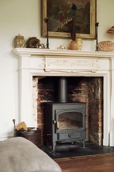 a fireplace with a wood burning stove in it