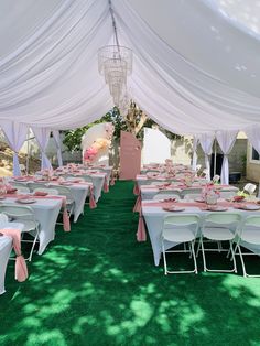 tables and chairs are set up under a tent