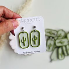 Dainty dangle light sage color rectangle polymer clay earrings with a green cactus in the center, this earrings are so cute for those who love cactus. Made with care and attention to detail, they make a great addition to any outfit and are perfect for any occasion. This dainty dangle earrings are lightweight and comfortable to wear, so you can enjoy them all day long.  Please note that due to the camera lenses, the color of the product may appear slightly different in photos and because these ea Ear Dressing, Desert Style, Desert Fashion, Cactus Earrings, Green Cactus, Sage Color, Camera Lenses, Unique Gifts For Her, Clay Creations