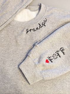 Custom Grandpa Embroidered Sweatshirt With Grandkids Names Daddy Papa All hoodies and crewneck sweatshirts are fleece. 65% cotton 35% poly Care instructions: Machine cold wash, inside out, with like colors. Only non-chlorine bleach. Tumble dry low. Medium iron. Do not iron decoration. Double-needle stitched neckline, bottom hem and sleeves t-shirt. Unisex sizing. Size chart is [...] Family Matching Cotton Sweatshirt For Winter, Fleece Crew Neck Sweater With Letter Embroidery, Family Matching Long Sleeve Cotton Sweatshirt, Crew Neck Fleece Hoodie With Letter Embroidery, Crew Neck Fleece Sweatshirt With Embroidered Text, Fleece Crew Sweatshirt With Letter Embroidery, Gray Long Sleeve Sweatshirt With Letter Embroidery, Gray Winter Sweatshirt With Embroidered Text, Gray Cotton Sweatshirt With Letter Embroidery