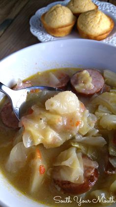 a white bowl filled with cabbage and sausage soup