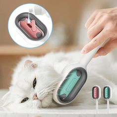 the cat is laying down with its head on top of an electric toothbrushes