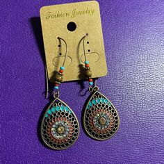 Nwt Boho Bronze Dangle Earrings With Swarovski Crystal And Turquoise Beeds And Color Fill Accents. Bohemian Brown Teardrop Earrings For Pierced Ears, Bohemian Brown Teardrop Earrings, Brown Metal Beaded Drop Earrings, Swarovski Crystal, Blue Brown, Swarovski Crystals, Dangle Earrings, Color Blue, Jewelry Earrings