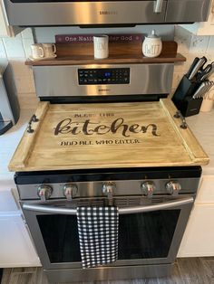 a kitchen stove with a wooden sign on it