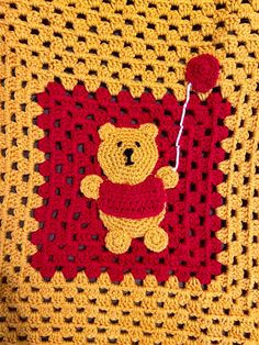 a crocheted square with a teddy bear on it