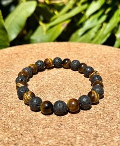 HOW FAST IS SHIPPING? -Make your purchase today and choose one of three shipping options. We usually process orders in one day for even faster shipping Essential Oil: Lava bead bracelets can be used with essential oils. Just add a drop or two to the lava stone. *Protection: The Tiger's Eye is often considered a protective stone. It is believed to create a shield against negative energies and psychic attacks. Some people carry or wear Tiger's Eye as a talisman for protection. Grounding and Balance **Courage and Confidence Prosperity and Abundance: Tiger's Eye is sometimes associated with attracting wealth and good fortune. It is believed to enhance one's ability to manifest goals and achieve success. = Lava Stone is a powerful crystal, that can bring to the wearer strength, courage, groundi Healing Bracelet With Gemstone Beads And Lava Stone, Healing Lava Stone Bracelets With Gemstone Beads, Hand-strung Lava Stone Bracelets, Brown Spacer Beads Jewelry For Meditation, Healing Lava Stone Beaded Bracelets, Round Beads Bracelet With Natural Lava Stone, Spiritual Lava Stone Beaded Bracelets With 8mm Beads, Spiritual Lava Stone Bracelets With 8mm Beads, Lava Stone Beaded Bracelet Jewelry