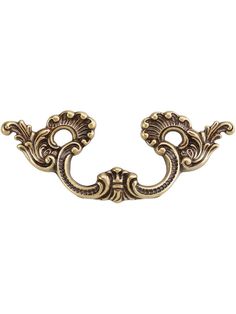 an antique brass door handle on a white background