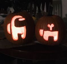 two pumpkins carved to look like elephants