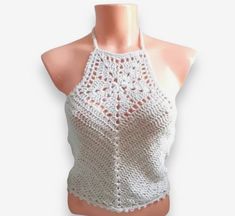 Make heads turn with this unique and stylish handmade crochet halter top, perfect for a special gift or to add a touch of glamour to your wardrobe! This crochet backless crop top combines comfort and elegance, making it an ideal item for any fashion-forward woman. This boho chic crochet crop halter top is made with cotton yarn. It's a perfect top for festivals, beach days, or just to show off your waist.  Recommended care : Hand wash in cold/warm water and lay flat to dry. This item will be pack Crochet Halter Neck Top For Festivals, Festival Crochet Halter Neck Top, Sleeveless Crochet Crop Top For Party, Party Crochet Halter Neck Top, Bohemian Halter Neck Crochet Top For Party, Silk Tops For Women, Summer Top Crochet, Yarn Wig, Beard Hat