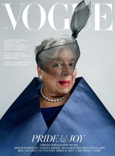 an older woman wearing a blue dress and hat on the cover of a magazine,