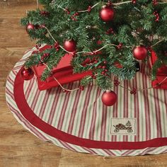 a christmas tree skirt with ornaments on it