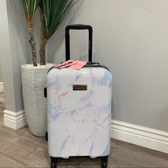 Featuring A Chic Rainbow Marble Pattern , The Juicy Couture Hardside Luggage Collection Is The Perfect Travel Companion. The Design Boasts 4 Wheels, A Retractable Push-Button Handle, And A Durable, Hardside Exterior. Provides Glamour And Function Retractable Push-Button Handle Zipper Closure Durable, Hardside Exterior Polyester Wipe Clean Luggage Sizing: 21-In.: 21"H X 12"W X 8"D White Rectangular Travel Accessories For On-the-go, Luxury White Bags With Luggage Sleeve, Designer Luggage With Sleeve For Trip, White Rectangular Travel Bag For Shopping, Luxury White Luggage For Everyday Use, Elegant White Rectangular Luggage, Luxury White Rectangular Luggage, White Rectangular Everyday Luggage, Elegant White Luggage For Travel