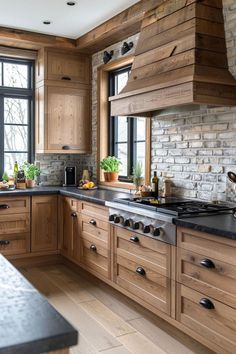 a kitchen with wooden cabinets and black counter tops, along with an island in the middle