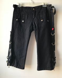 "Size: 9 Brand: Tripp NYC  Closure: Button fly zipper  Condition: Like new. No visible rips stains or imperfections. Measurements (lying flat not stretched): Waist 15.5\". Inseam 16\"." Emo Bottoms For Spring Streetwear, Edgy Black Knee-length Bottoms, Edgy Knee-length Black Bottoms, Black Knee-length Bottoms With Buttons, Y2k Mall Goth, Versace Pants, Woven Cardigan, Strap Pants, Black Capris