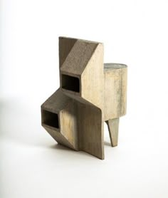 an object made out of concrete sitting on top of a table