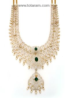 18 karat gold 'peacock - detachable / 11 in 1' diamond long necklace with color stones & culture pearls
    this product has a detachable pendant which can be used as a separate pendant with most chains.
  this product has inter changeable stones in the necklace and pendant.
  it can also be used as a short necklace
           

introducing the exquisite 18k gold 'peacock - detachable / 11 in 1' diamond long necklace with color stones & culture pearls, crafted by totaram jewelers. this stunning Formal Yellow Gold Jewelry With Peacock Design, Formal Yellow Gold Peacock-designed Jewelry, Formal Yellow Gold Peacock Jewelry, Elegant Gold Plated Peacock Design Jewelry, Gold Necklace With Peacock Design For Receptions, Gold Bridal Necklace With Peacock Design For Reception, Gold Emerald Necklace With Intricate Design For Reception, Elegant Peacock Design Necklace For Reception, Elegant Peacock Design Jewelry For Reception