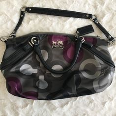 Nwot Coach Madison Sophia Sateen Clover Purse Handbag -Color = Black/Purple/Grey Pattern On Fabric; Black Leather Straps & Trim With Chrome Hardware; Mauve/Violet Interior Fabric. -Fit = Medium Size, Satchel Style Perfect For Everyday Use. The Bag Features A Zipper Closure, Three Inside Pockets (Cell Phone Pocket, Open Pocket, And Zippered Pocket), And A Bag Charm. Features Two Handle Straps And Detachable Shoulder Strap. -Content = Sateen Fabric Exterior/Interior. Leather Straps And Trim Throug Purple Crossbody Bag With Zipper Closure, Coach Purple Shoulder Bag With Top Carry Handle, Purple Bag With Detachable Strap For On-the-go, Purple Crossbody Shoulder Bag With Detachable Handle, Purple Shoulder Bag With Double Handle And Zipper Closure, Purple Handheld Shoulder Bag With Top Carry Handle, Purple Detachable Handle Crossbody Shoulder Bag, Purple Handheld Satchel For Travel, Purple Satchel Tote With Zipper Closure