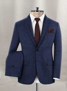 Sprinkle the stylish elegance with our Napolean Koro Wool Suit, which embraces the boldness of sartorial ambitions. Appoint a classy sophistication with our suit, crafted from a wool blend fabric that outlines a smooth, feathery texture with delicate accents and a stripes pattern over a blue tint that highlights vibrant character. Balance an exquisite taste with a sublimely tailored blue suit that captures a sense of luxury while ensuring ideal relaxation to pursue exhilarating occasions and cru Master Tailor, Custom Suit, Wool Suit, Custom Tailoring, Blue Suit, Jacket Buttons, Wool Fabric, Black Button, Jacket Style