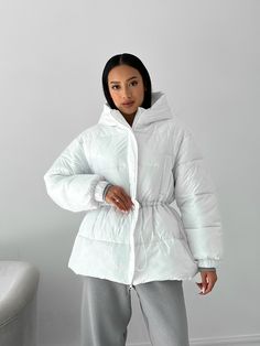 Oversized short puffer jacket for winter, super warm and cozy. Our puffer jacket is a valuable asset to your wardrobe. It will keep you warm due to its synthetic feathers, which is called "air feathers". MEASUREMENTS of THE PUFFER JACKET Jacket length (along the back) 26.7 inches or 68 cm Sleeve length (from the shoulder seam) 22.8 inches or 58 cm shoulder length 6 inches or 15 cm width in the bust area is 24.8 inches or 63 cm SIZES 1 universal size, fits women of S-M sizes M BUST up to 39 inche Hooded Winter White Outerwear With Ribbed Cuffs, Trendy Puffer Hooded Jacket For Cold Weather, Solid Puffer Jacket With Drawstring Hood For Cold Weather, Puffer Jacket With Drawstring Hood For Cold Weather, Hooded Winter White Puffer Jacket For Cold Weather, White Quilted Jacket For Winter, White Quilted Puffer Jacket For Winter, White Puffer Parka For Fall, White Puffer Quilted Jacket For Winter