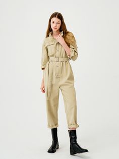 Editor's NotesThis PANDORA.FITâs jumpsuit is cut from cotton to an oversized fit with the waist strap that can adjust the silhouette. It has the high neck and a button closure at the front.- Oversized fit- High neck- Adjustable waist strap- Button closure- Big flap pocketsMeasurements(in.)1 / 2- Shoulder: 20.47 in. / 21.65 in.- Bust: 21.65 in. / 22.83 in.- Armhole: 8.46 in. / 8.86 in.- Sleeve length: 17.32 in. / 17.72 in.- Sleeve opening: 4.72 in. / 5.12 in.- Waist: 21.26 in. / Utility Style Belted Jumpsuit For Fall, Utility Style Jumpsuits And Rompers With Button Closure, Belted Utility Jumpsuit For Spring, Spring Cotton Belted Jumpsuits And Rompers, Belted Utility Jumpsuits And Rompers For Spring, Spring Utility Belted Jumpsuits And Rompers, Khaki Cotton Jumpsuits And Rompers For Fall, Casual Spring Jumpsuits And Rompers With Belted Cuffs, Belted Relaxed Fit Jumpsuit For Work