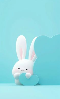 a small white rabbit sitting next to a blue cloud