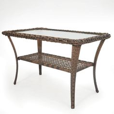 a wicker table with glass top on white background